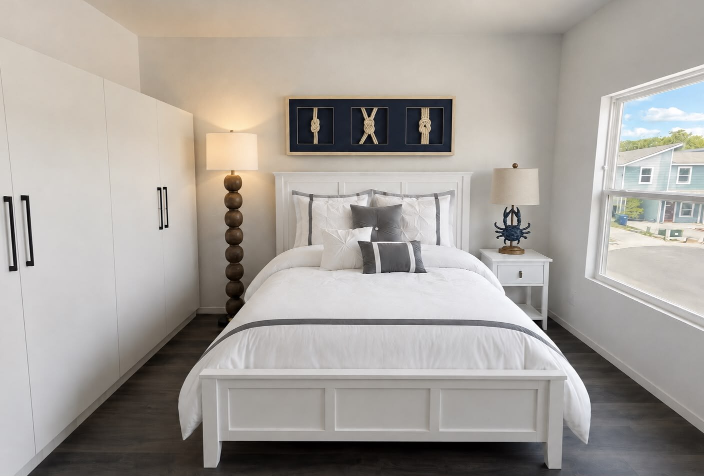 Plan 3 furnished bedroom with white built-in storage and blue-gray accents